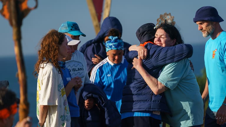 Polly Gillespie embraces her teammates following her exit