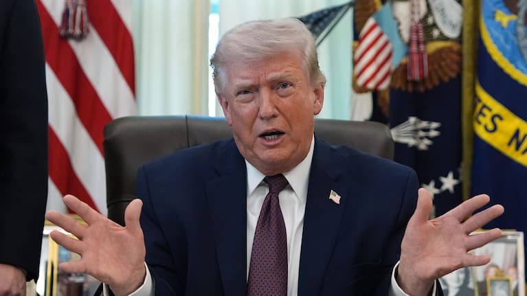 President Donald Trump speaks in the Oval Office of the White House before signing an executive order.