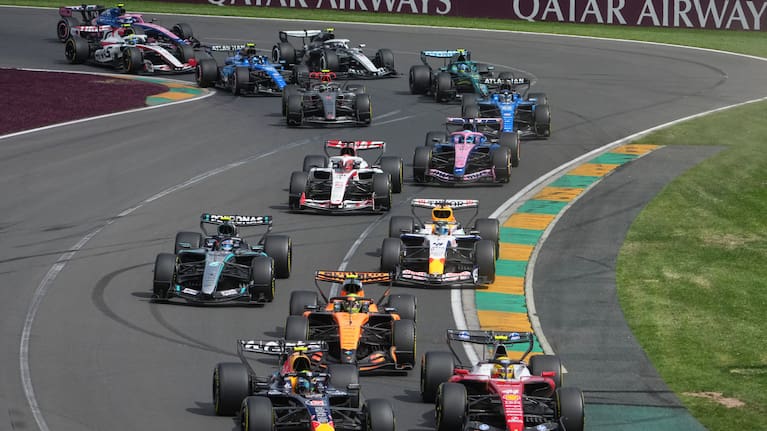 Red Bull driver Isack Hadjar, left, of France and Ferrari driver Lewis Hamilton of Britain steer their cars out of turn two at the start of the Australian Formula One Grand Prix
