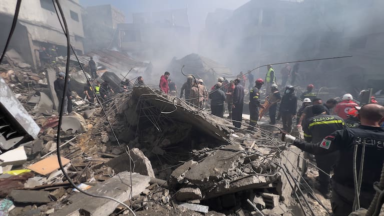 Rescue workers search for victims at the site of an Israeli airstrike that hit a crowded neighbourhood south of Beirut, Lebanon, Sunday, April 5, 2026.