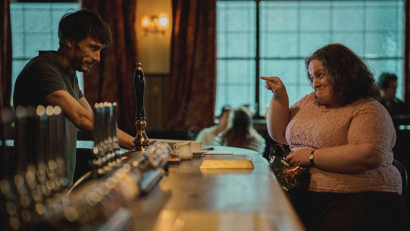 Richard Gadd as Donny and Jessica Gunning as Martha talk at the bar.