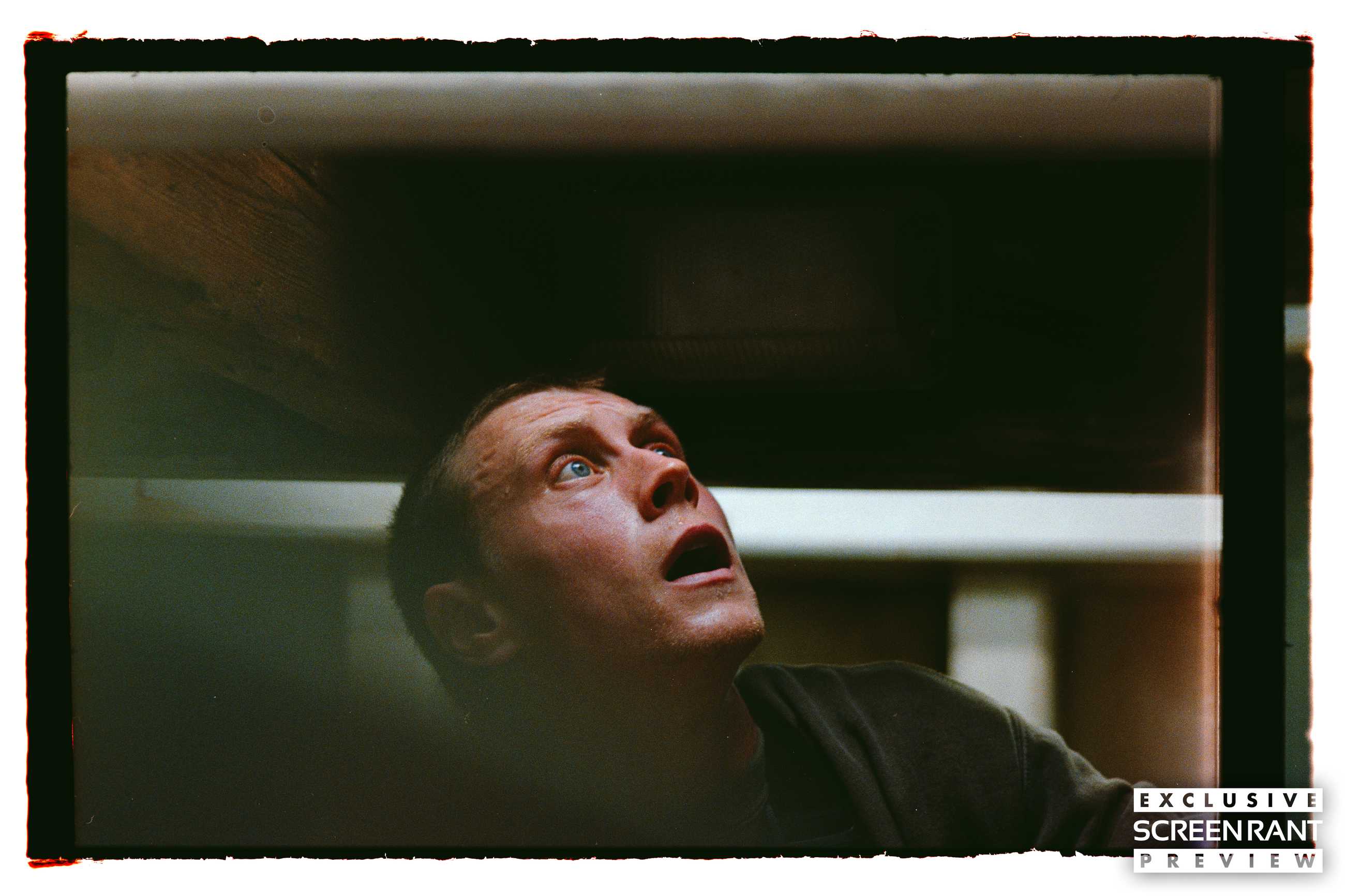 George MacKay looking up wide-eyed in Rose of Nevada