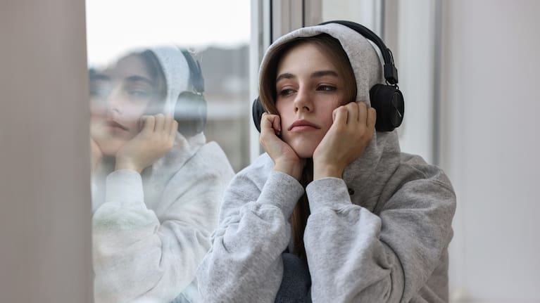 Sad girl listening to music