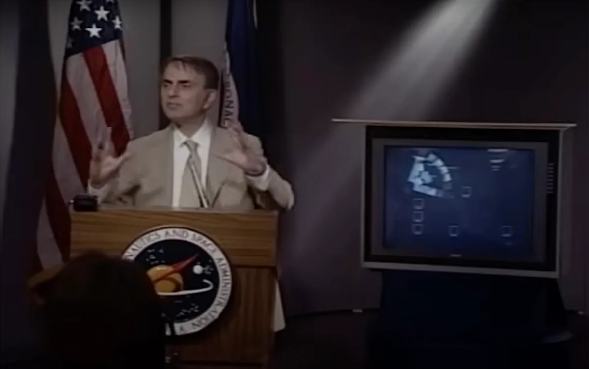 Carl Sagan reveals the Solar System Family Portrait, captured by Voyager 1, during a NASA press conference on 6 June 1990. Credit: NASA/JPL