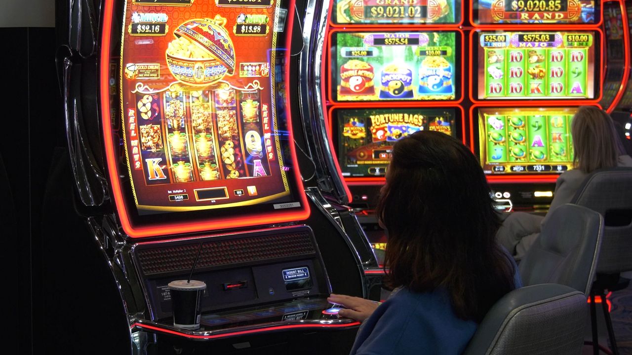 people seated at slot machines