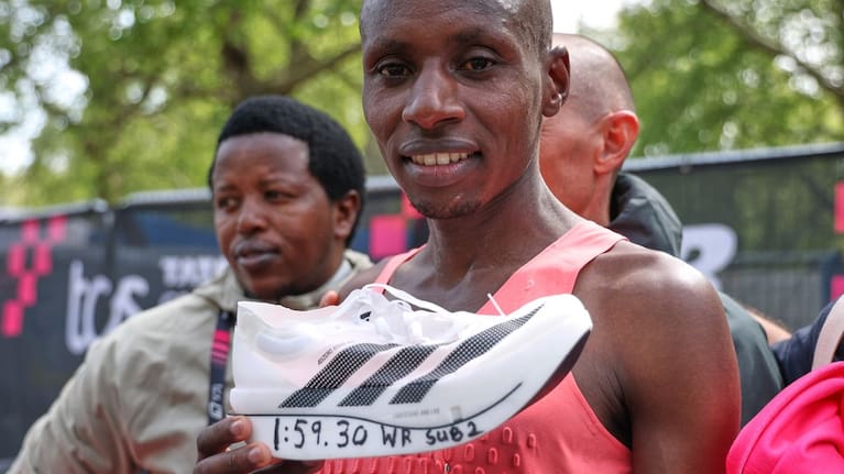 Sebastian Sawe from Kenya celebrates winning the men's race at the London Marathon in London.