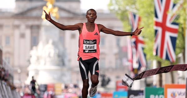 Runner breaks fabled two-hour barrier