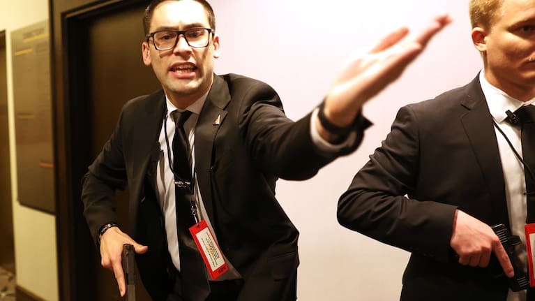 Secret service agents respond during the White House Correspondents Dinner.