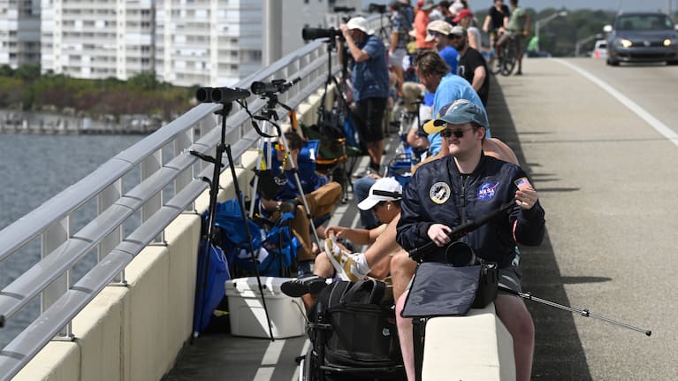 Space enthusiasts set up on the A. Max Brewer Bridge to view the NASA Artemis II launch