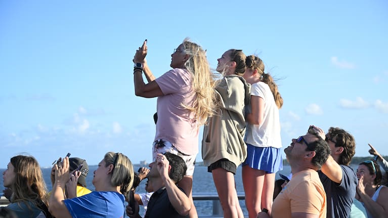 Spectators view NASA's Artemis II moon rocket launch.