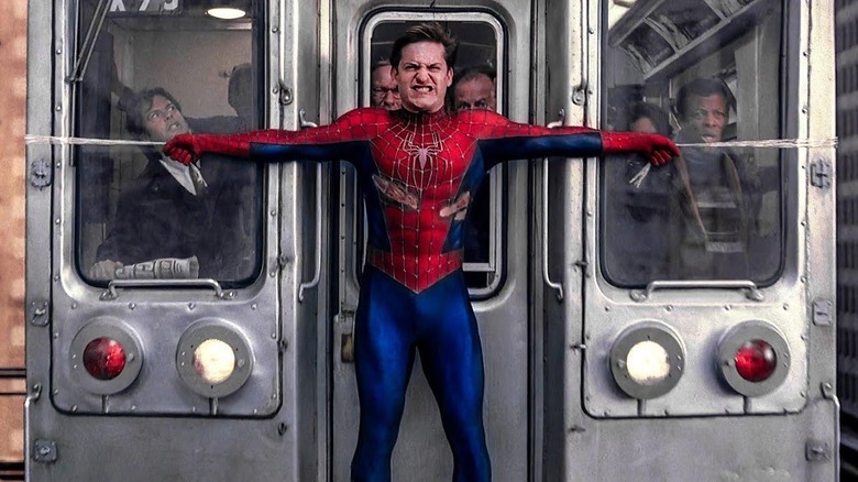 Spider-Man (Tobey Maguire) holding a train in 