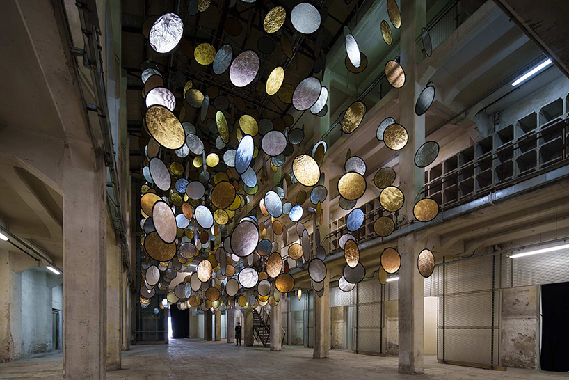 SpY’s kinetic installation suspends rotating gold and silver halos inside florence atrium - 1