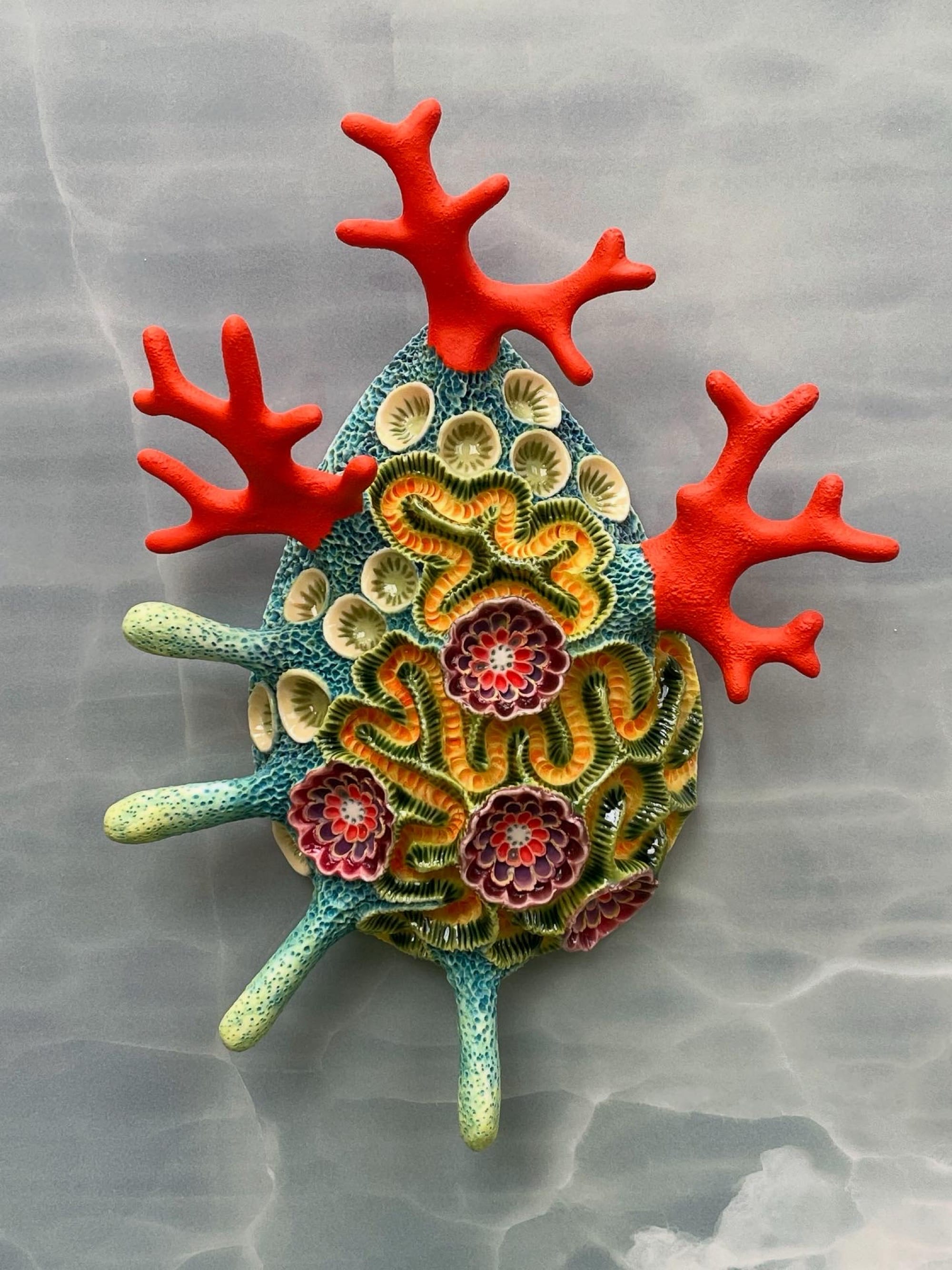 a coral-inspired, colorful ceramic sculpture by Lisa Stevens