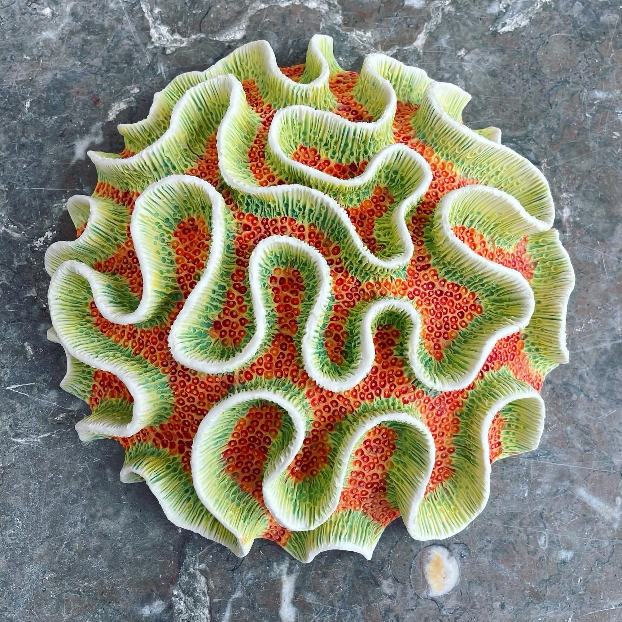a coral-inspired, colorful ceramic sculpture by Lisa Stevens