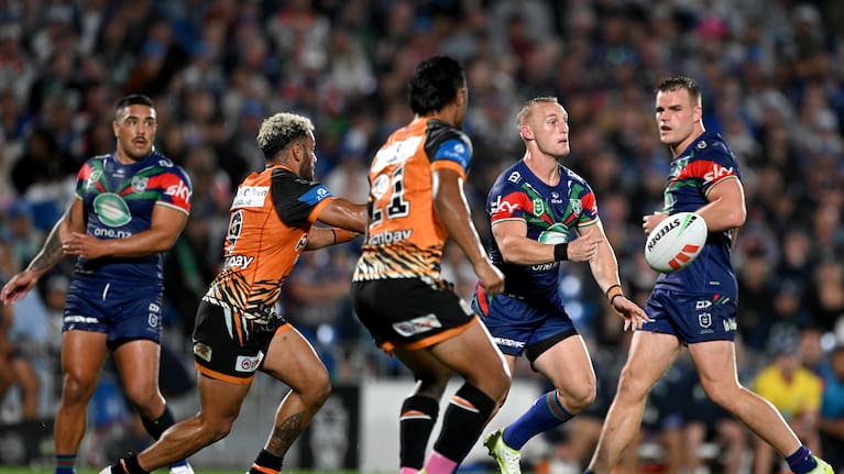 Tanah Boyd of Warriors (second right) mid game against Wests Tigers.