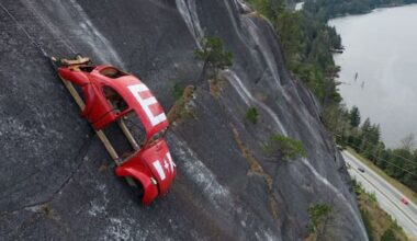 Car shell suspended on rockface above Canada highway in apparent prank