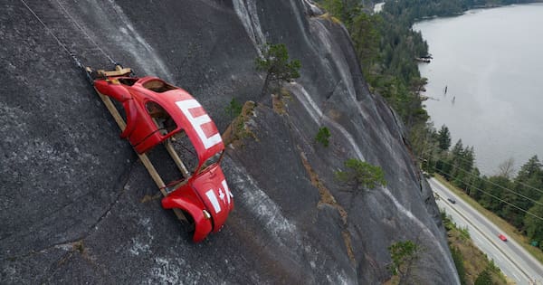 Car shell suspended on rockface above Canada highway in apparent prank