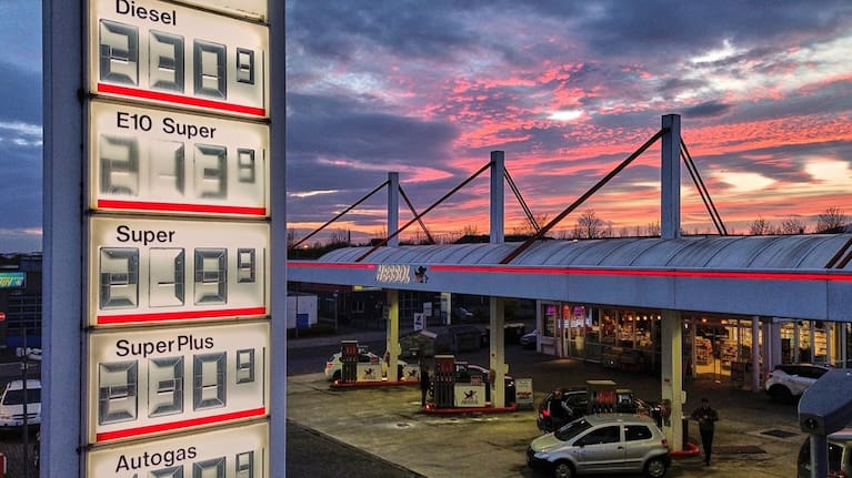 The sun has set behind a gas station in Frankfurt, Germany.