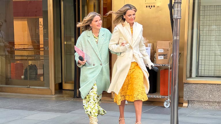 This image released by NBC shows co-host Savannah Guthrie, right, walking with colleague Jenna Bush Hager outside of Rockefeller Centre.