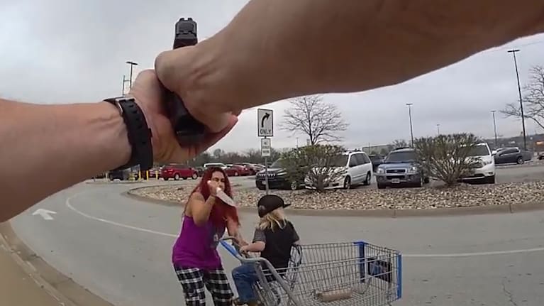 This police body cam still image provided by the Omaha Police Department shows an Omaha police officer responding to a woman they say kidnapped a young boy and slashed him across the face before killing her in Omaha, Nebraska.