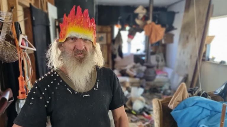 Tongaporutu Rd resident 'Rambo' reckoned he'd eventually be able to move back into his flood-damaged home. (Source: RNZ / Robin Martin) 