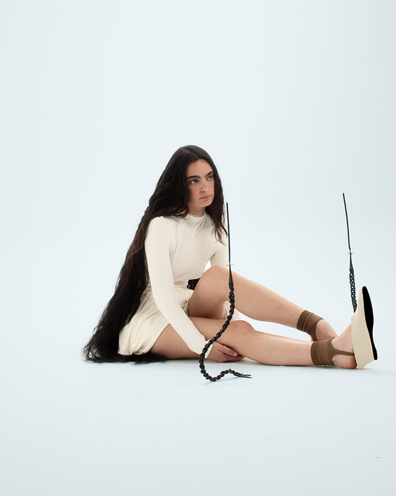 interlaced wood, metal, and fiber explore braiding as construction method in trenzar series - 1