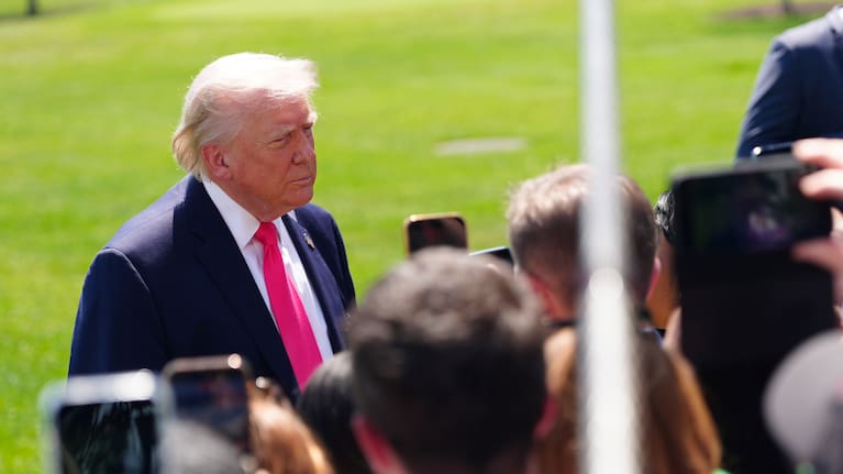 President Donald Trump speaks with reporters before departing on Marine One from the South Lawn of the White House