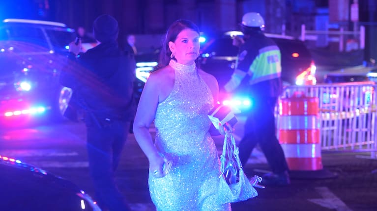 A guest leaves the White House Correspondents Dinner, Saturday, April 25, 2026
