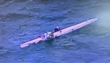 Pair rescued after being found clinging to kayak amid rough seas