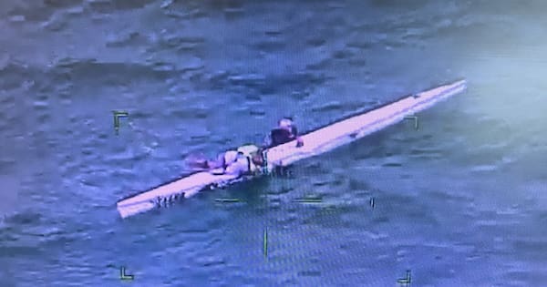 Pair rescued after being found clinging to kayak amid rough seas