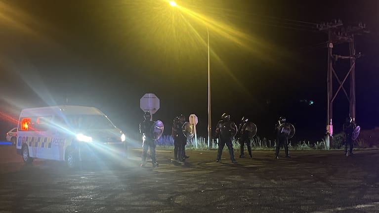 Two police vehicles were damaged by projectiles thrown from the crowd.
