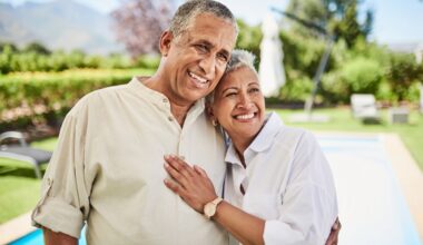 Two people embracing outdoors.