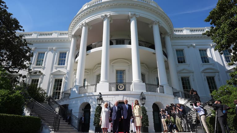 US President Donald Trump and first lady Melania Trump greet Britain's King Charles III and Queen Camilla as they arrive at the White House.