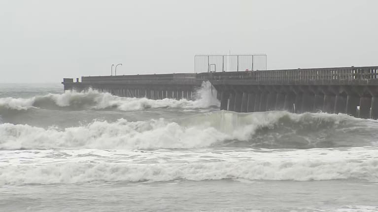 Waves crash against the Tolaga Bay wharf on the East Coast of the North Island.