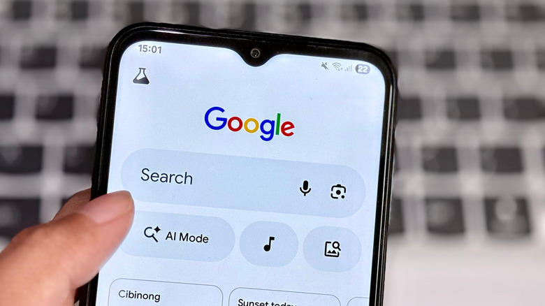 The top half a phone showing the Google search page.