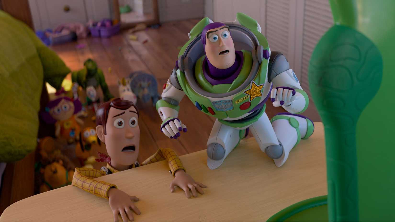 Woody and Buzz looking afraid in Toy Story 5