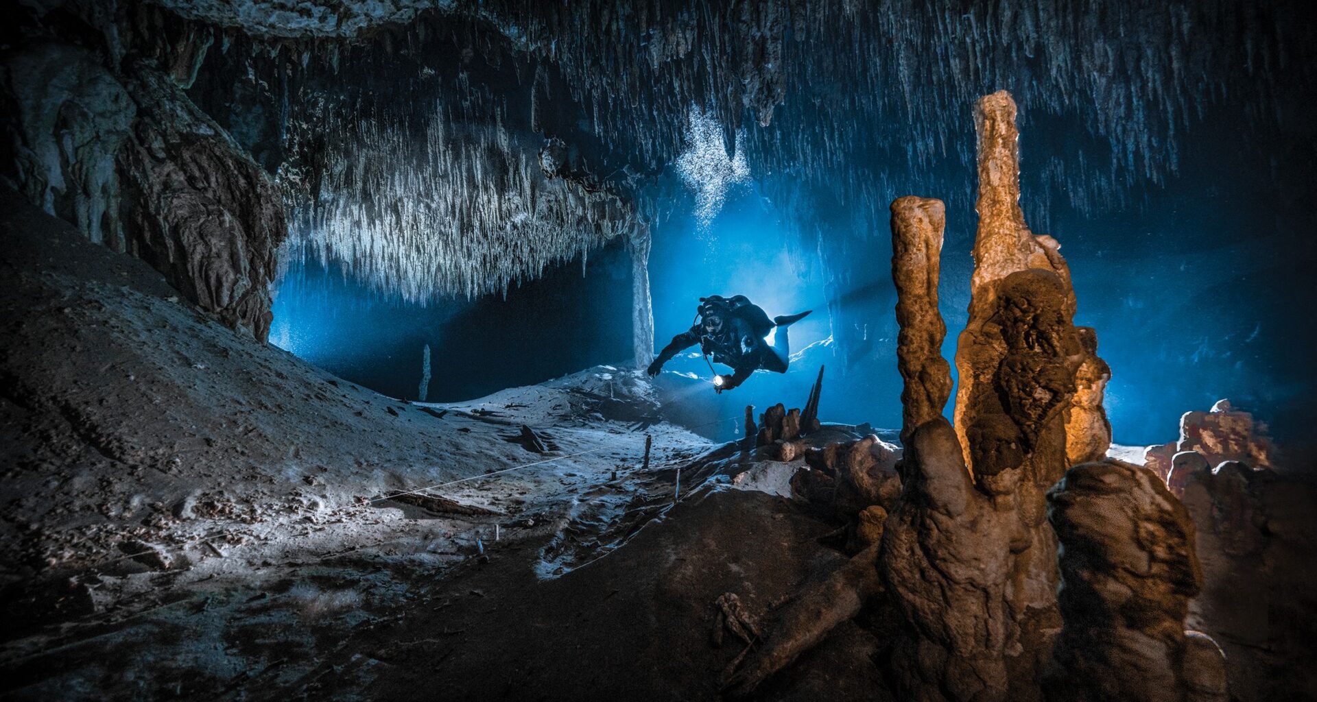 The cave was pitch black – so to create this magical underwater shot, the photographer had to use all his camera expertise...