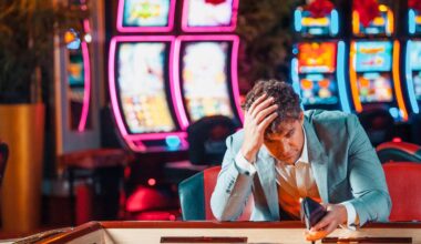 Mature men using smart phone for sports betting.