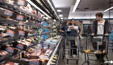 US revises first quarter growth down while inflation climbs