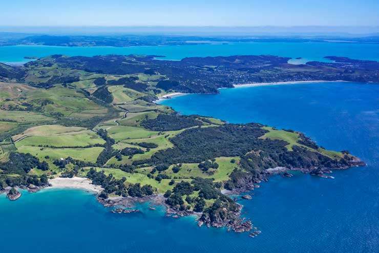 Bayleys agents Duncan Ross and Sarah Dyer have sold Andersons Cove, in Langs Beach, Whangarei. The resort was on the market seeking more than $50 million. Artwork / Beth Walsh
