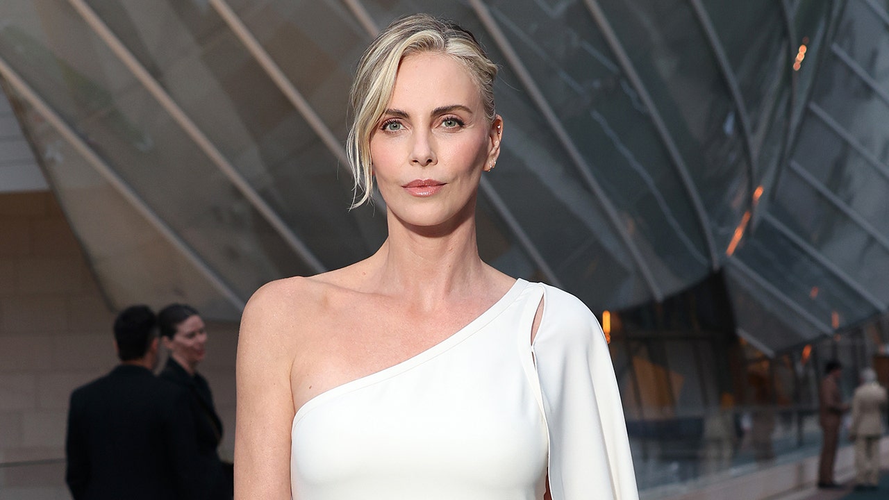 Charlize Theron says her kids won’t get a free ride and ‘they need to earn it’