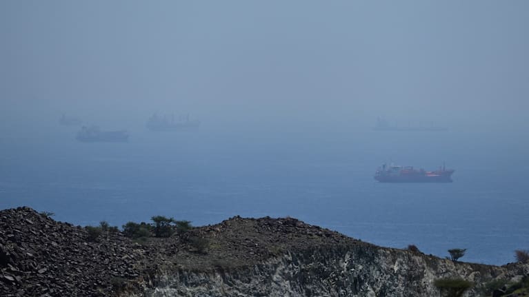 Tankers and bulk carriers anchored in the Strait of Hormuz.