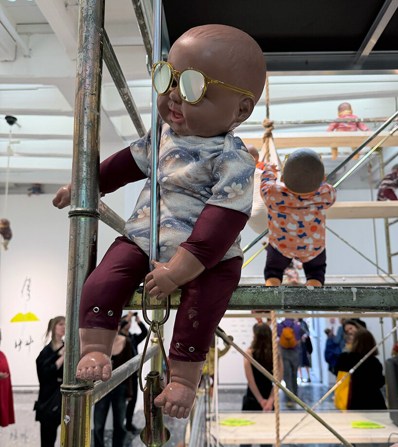208 baby dolls animate japan pavilion in ei arakawa-nash's playful ode to care - 7