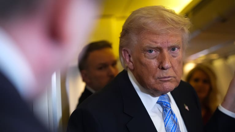 President Donald Trump speaks to reporters aboard Air Force One, Friday, May 15, 2026, as he returns from a trip to Beijing, China.
