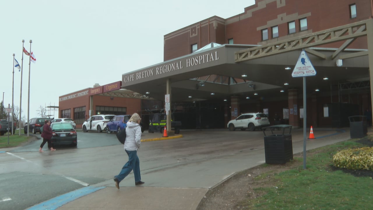 A person walks into the Cape Breton Regional Hospital.