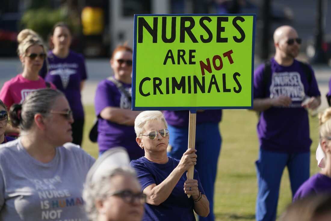 People demonstrate outside the courthouse where the sentencing hearing for former nurse RaDonda Vaught was held on May 13, 2022, in Nashville, Tenn.
