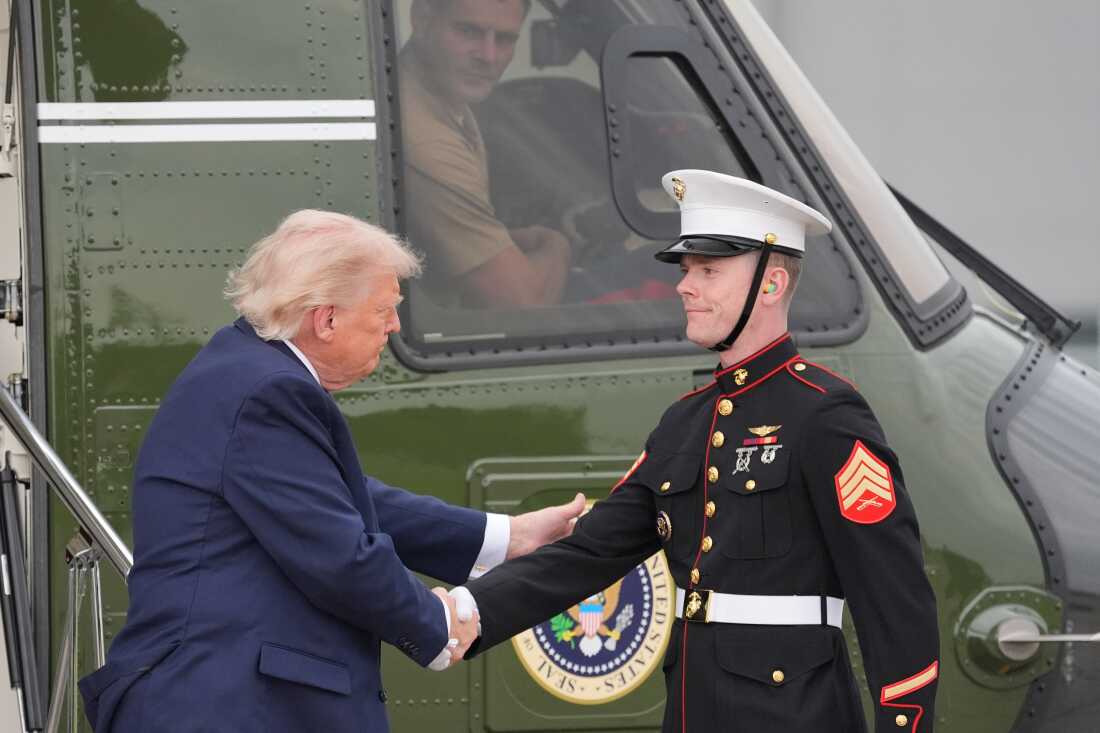 President Donald Trump shakes hands with a member of the U.S. Marine Corps as he arrives on Marine One to board Air Force One at Morristown Airport, Friday, May 22, 2026, in Morristown, N.J.