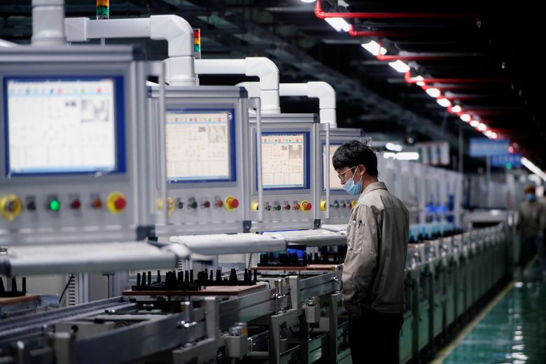 An employee works on the production line of EV battery manufacturer Octillion in China's Anhui province in 2021.