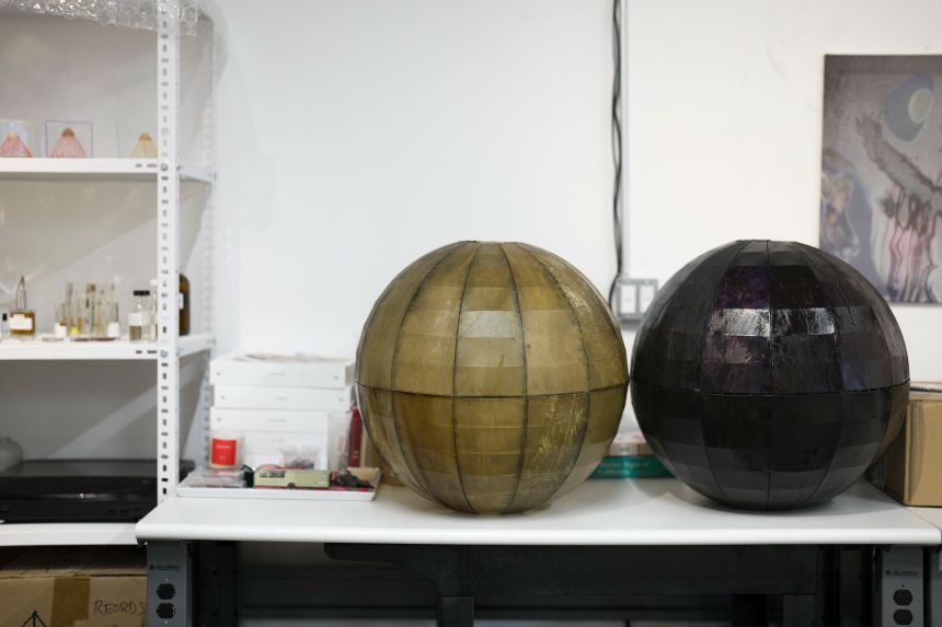 Bottled fragrances (left) sit next to dyed kelp lanterns from past installations. Yi’s explorations into the interconnectedness of humanity, flora, fauna and microbes are often multi-sensory.