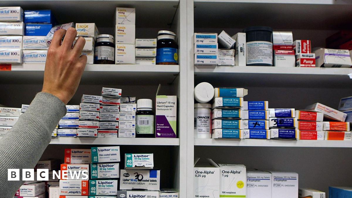 A pharmacist stocking shelves.